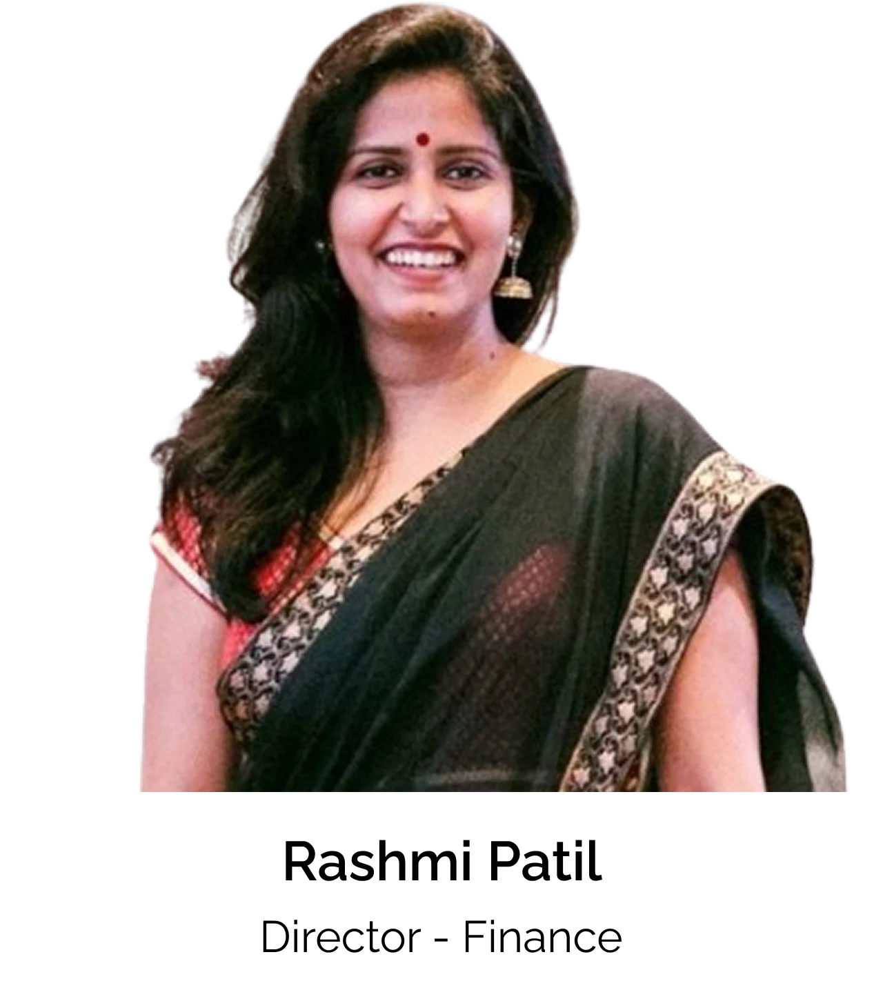 Portrait of a smiling woman wearing a dark saree with a patterned border, standing against a light background. Text below reads: “Rashmi Patil, Director – Finance.